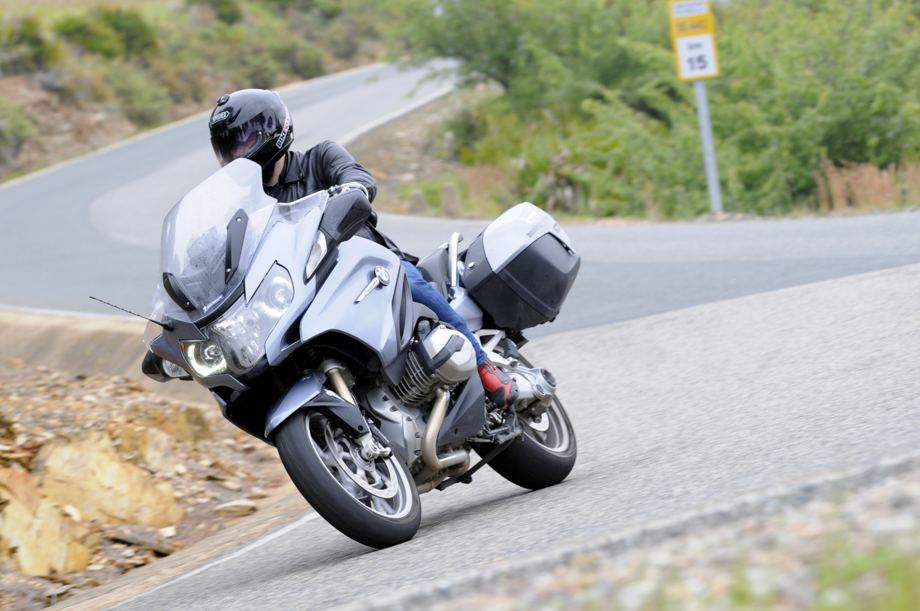 Motorbike rider with ear plugs